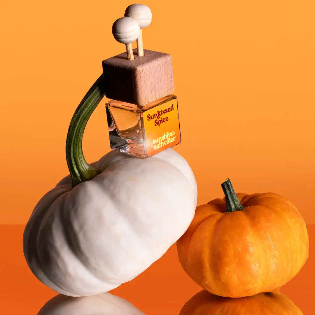 Car Diffuser labeled 'Sun Kissed Spice' on a white pumpkin with an orange background