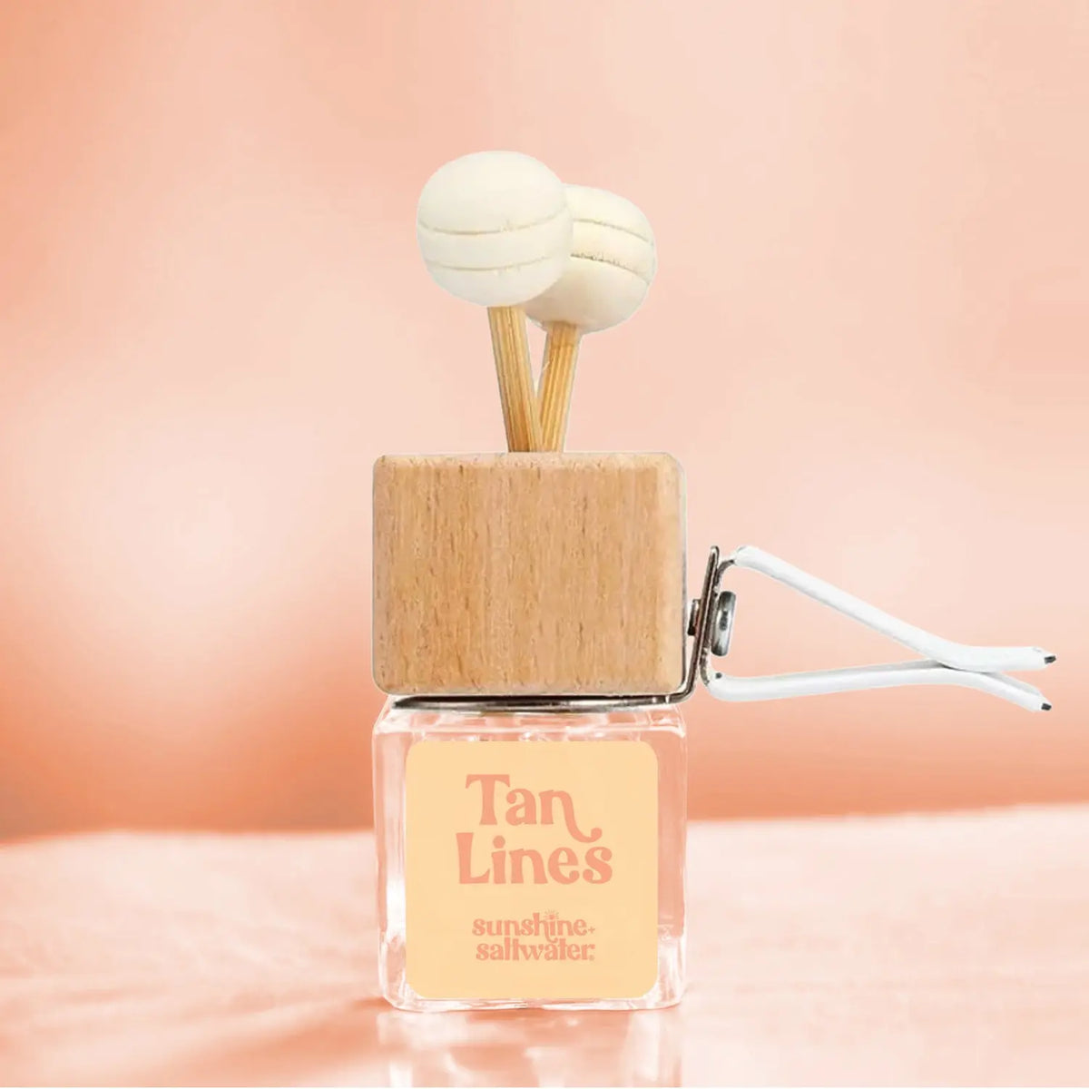 Tan Lines coconut and sunwashed woods car vent diffuser by Sunshine + Saltwater