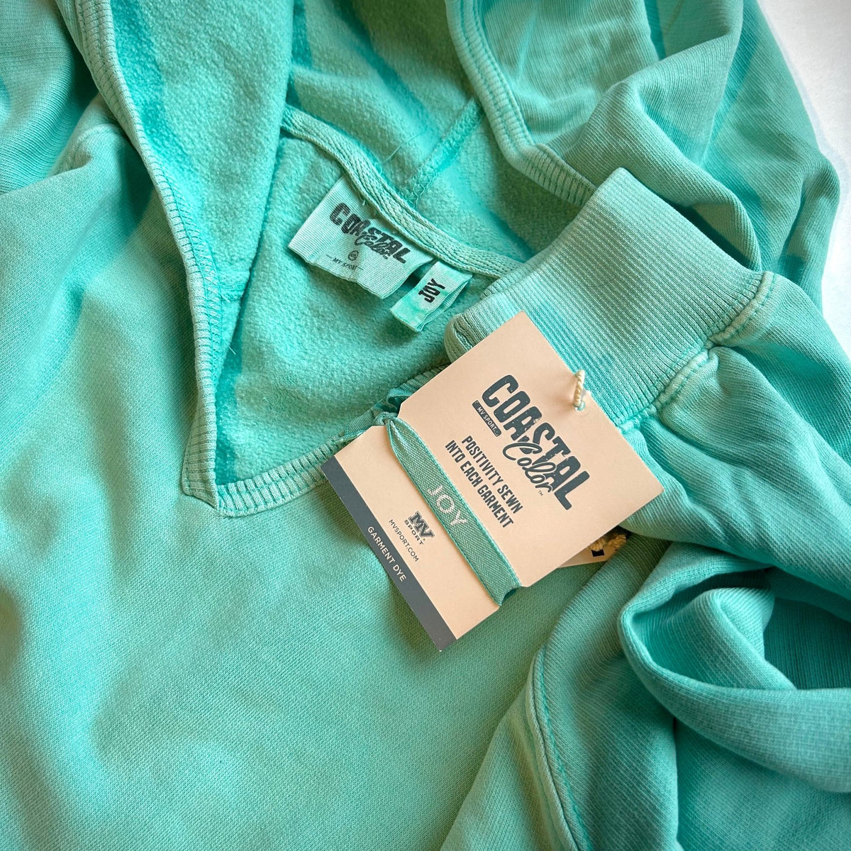 tags on coastal color blue hoodie