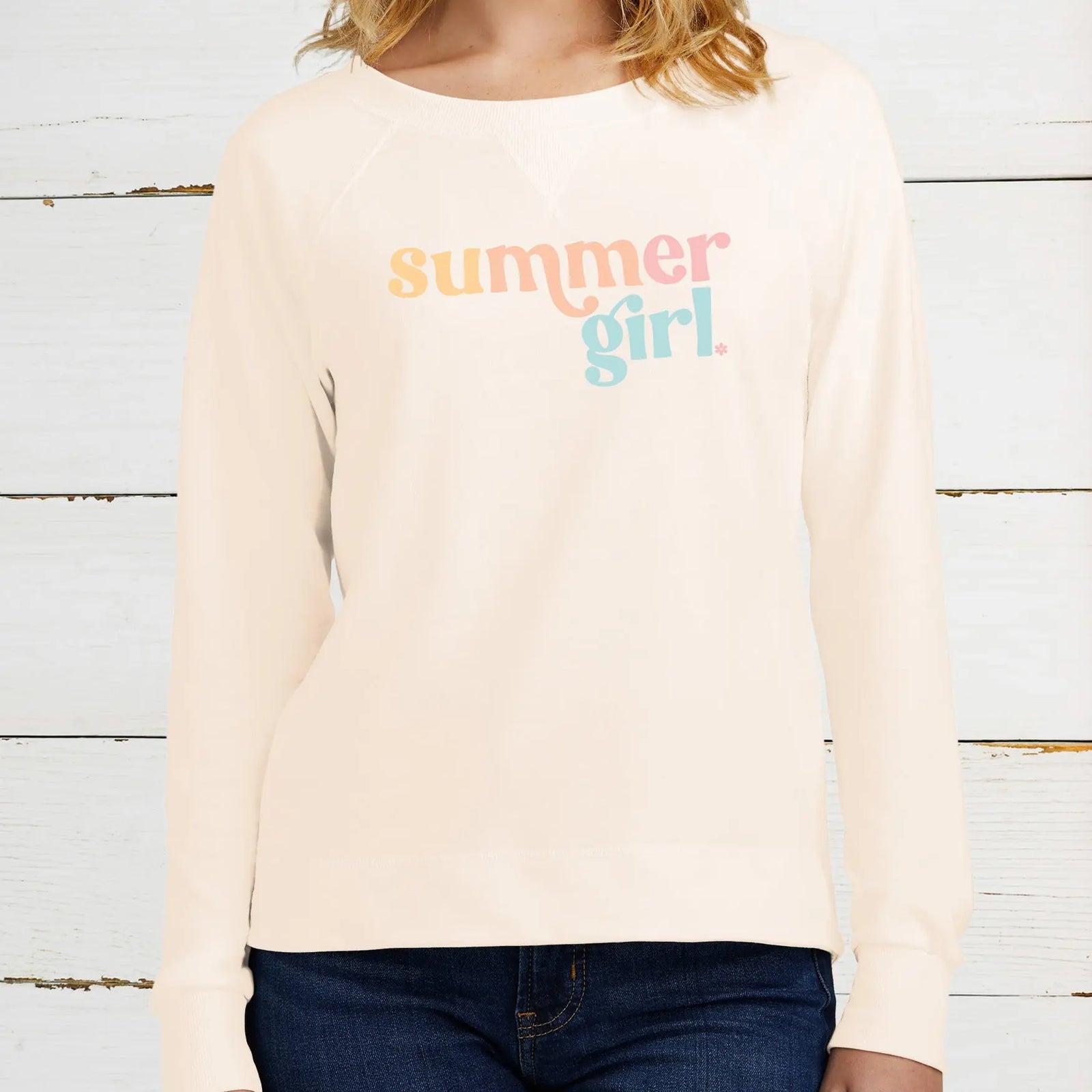 District Featherweight crewneck in cream color with summer girl printed in beachy colors