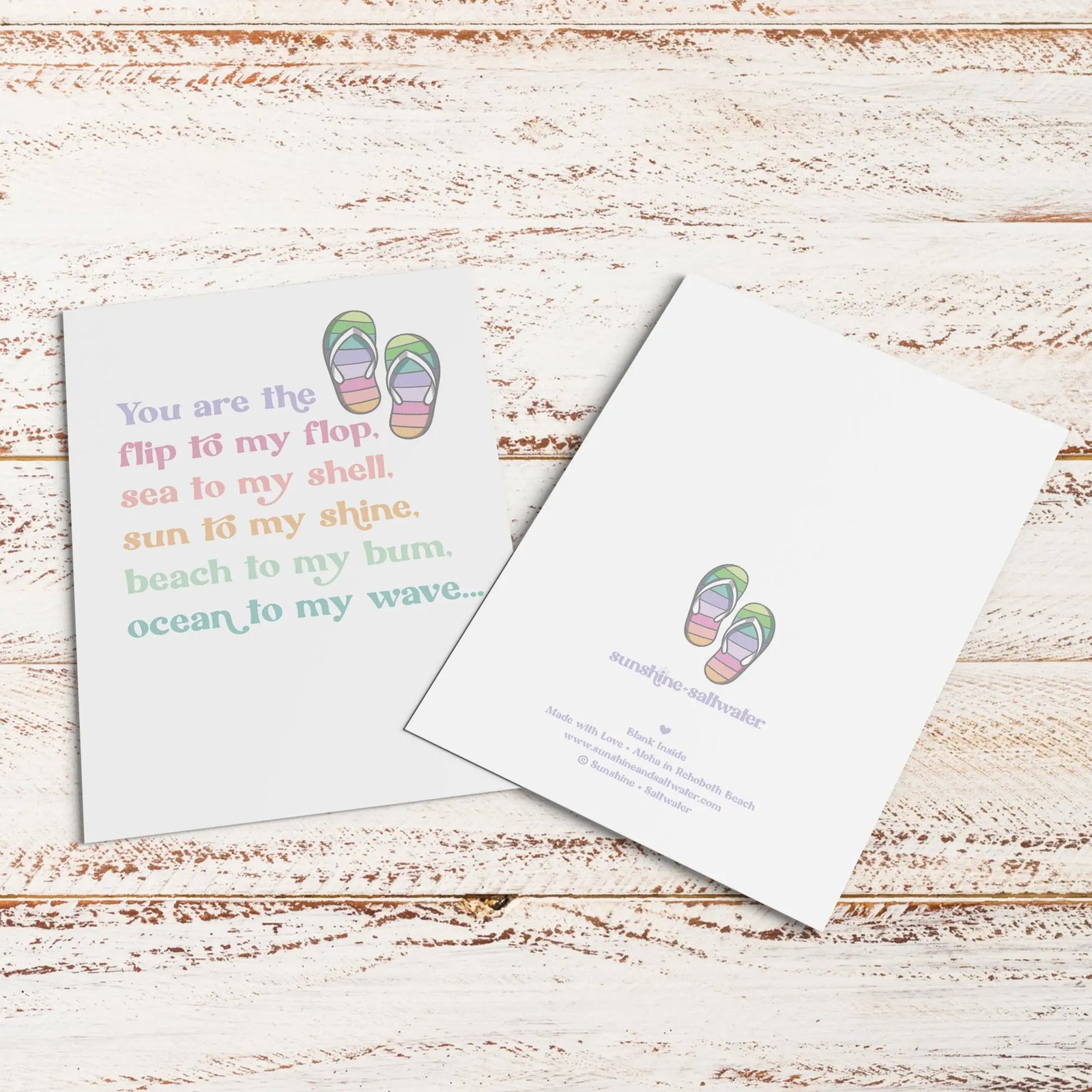 Flip flop greeting card with colorful fonts on white cover stock in front of kraft paper envelope