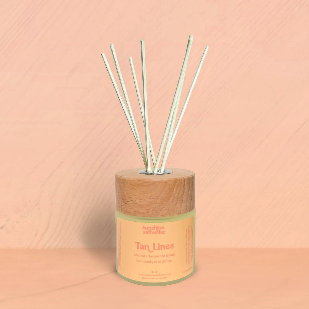 Tan Lines coconut and sunwashed woods reed diffuser by Sunshine + Saltwater