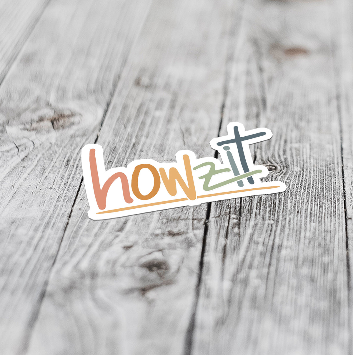 howzit Hawaiian slang sticker flat lay