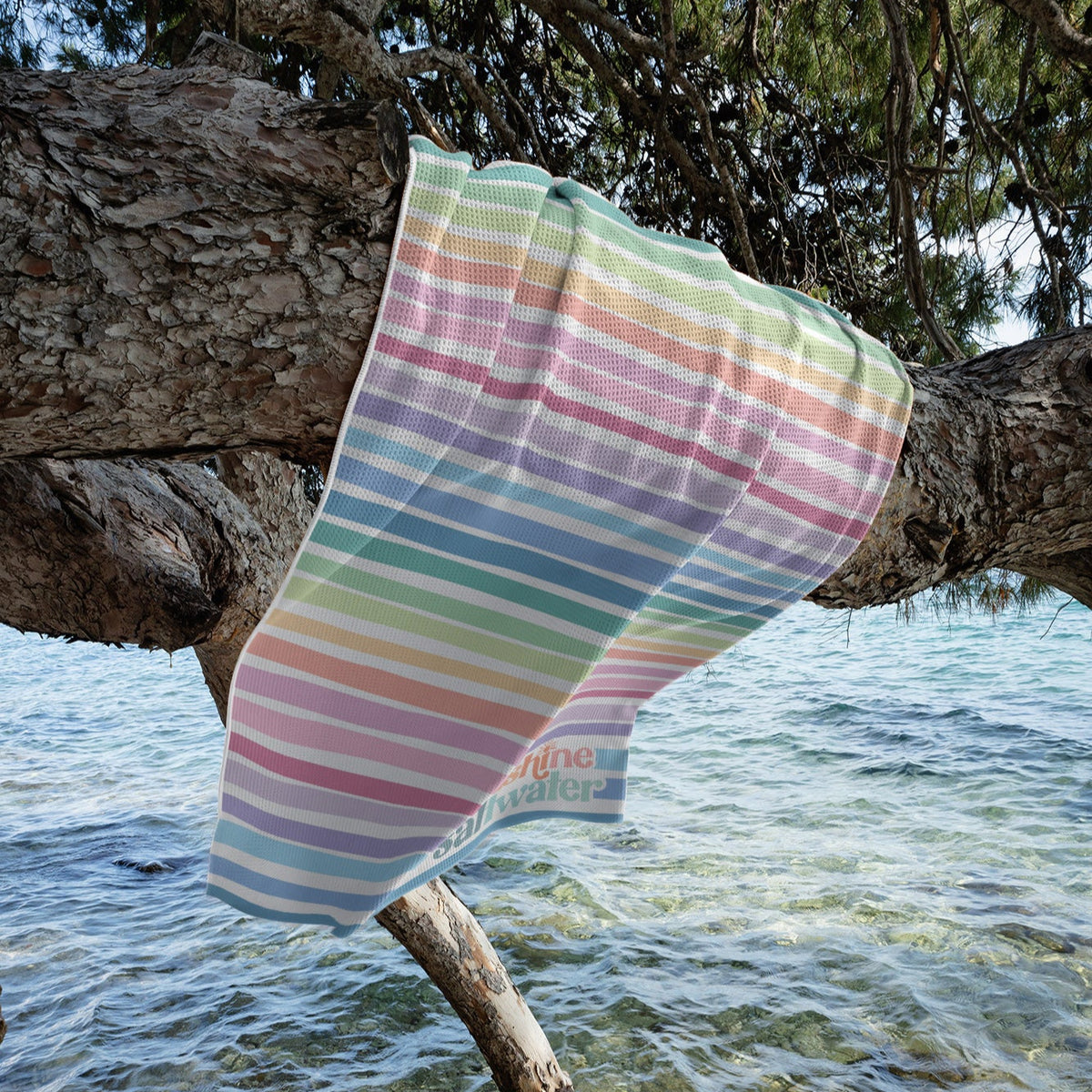 Close-up of Rainbow Reef towel’s waffle texture, featuring bold, tropical hues &amp; a sand-resistant design