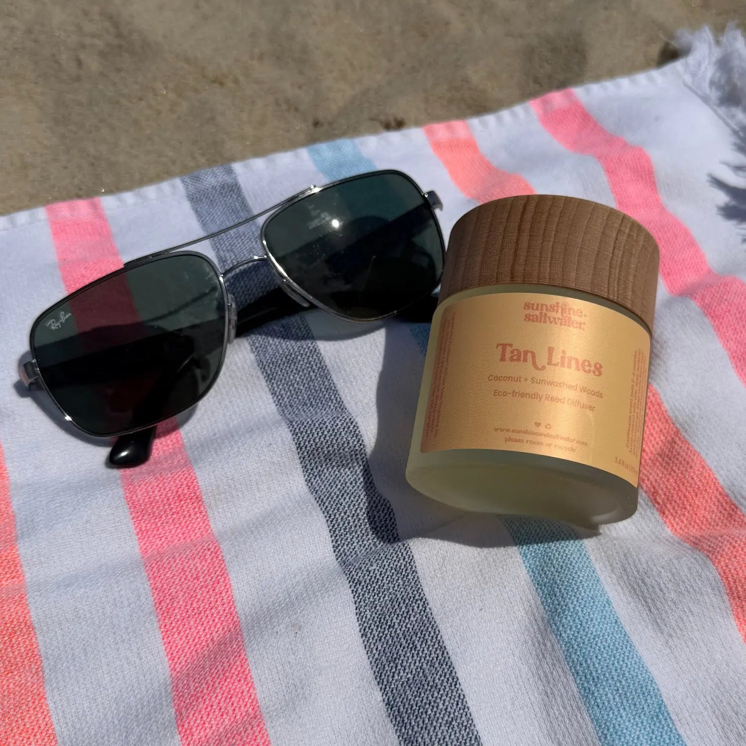 Tan Lines coconut and sunwashed woods reed diffuser by Sunshine + Saltwater